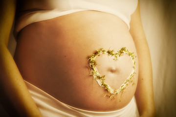 Image showing cress heart on baby bump