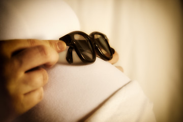 Image showing sun glasses on baby bump