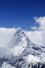 Image showing Snowy mountains in clouds