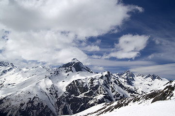 Image showing Snowy mountains and sky with clouds