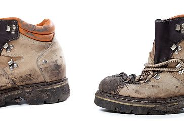 Image showing Old dirty hiking boots on white background