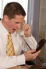 Image showing Businessman shouting on phone