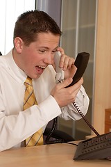 Image showing Businessman shouting on phone