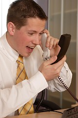 Image showing Businessman shouting on phone