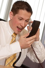 Image showing Businessman shouting on phone