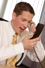 Image showing Businessman shouting on phone