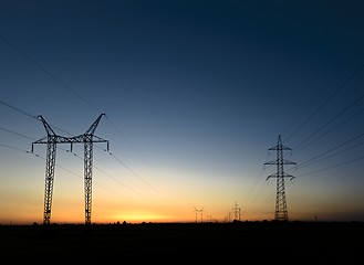 Image showing Large transmission towers at sunset