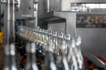 Image showing Many bottles on conveyor belt