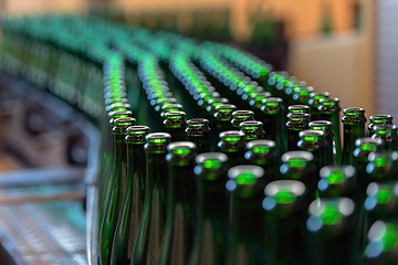 Image showing Many bottles on conveyor belt