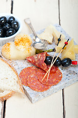 Image showing mix cold cut on a stone with fresh pears