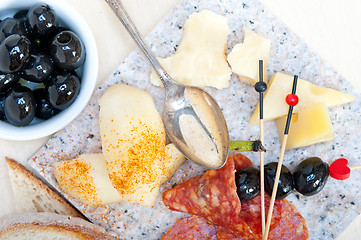 Image showing mix cold cut on a stone with fresh pears