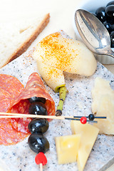 Image showing mix cold cut on a stone with fresh pears