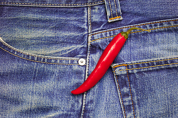 Image showing hot chili peppers in a jeans