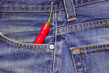 Image showing chili peppers in a jeans pocket