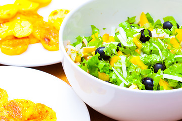 Image showing Assorted green leaf lettuce with squid and black olives