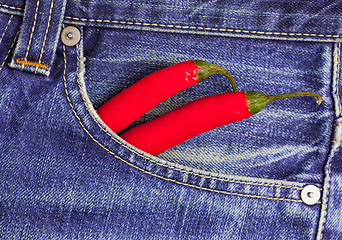 Image showing red peppers in a jeans pocket