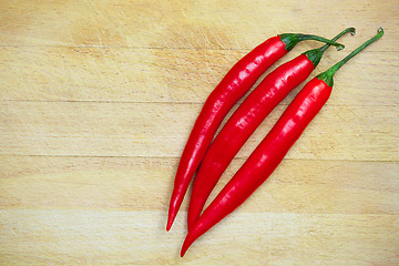 Image showing peppers on the wooden background