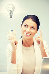 Image showing woman with cash euro money and light bulb