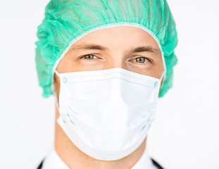 Image showing surgeon in medical cap and mask