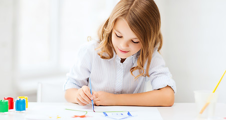 Image showing little girl painting at school