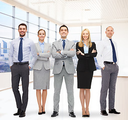 Image showing group of smiling businessmen over office room