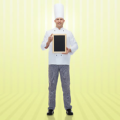 Image showing happy male chef cook holding blank menu board