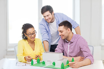 Image showing smiling architects working in office