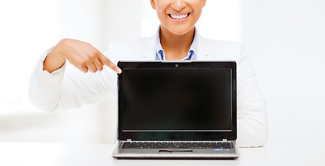 Image showing smiling woman with laptop computer