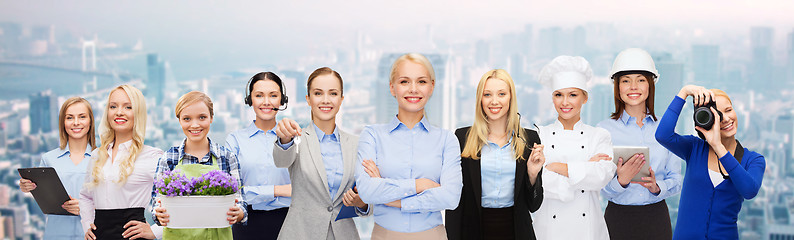 Image showing happy smiling businessman in suit pointing at you