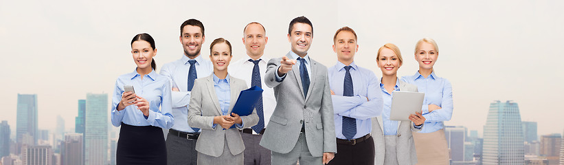 Image showing group of happy business people pointing at you