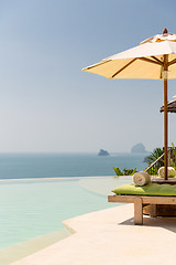 Image showing view from infinity edge pool with parasol to sea