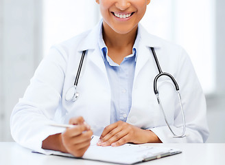 Image showing female doctor writing prescription