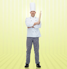 Image showing happy male chef cook holding rolling pin