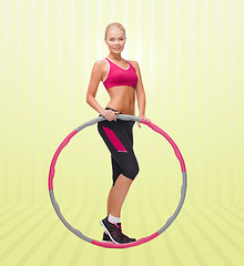 Image showing young sporty woman with hula hoop