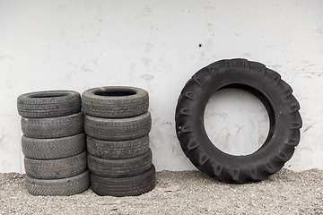 Image showing close up of wheel tires stored near wall