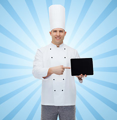 Image showing happy male chef cook showing with tablet pc