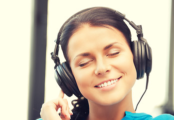 Image showing happy teenage girl in big headphones