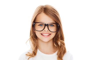 Image showing smiling cute little girl with black eyeglasses