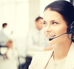 Image showing female helpline operator in call center