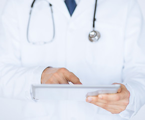 Image showing male doctor holding tablet pc