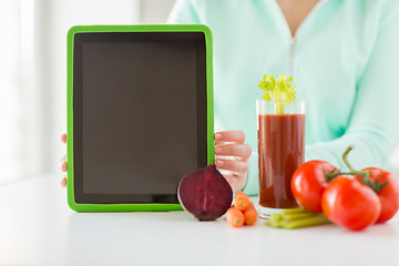 Image showing close up of woman with tablet pc and vegetables