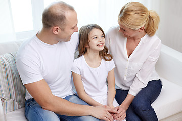 Image showing happy parents with little daughter at home