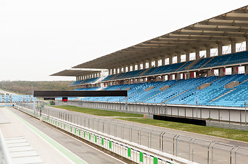 Image showing empty speedway and bleachers on stadium