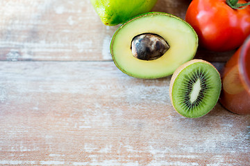 Image showing close up of fresh fruits and juice glass on table