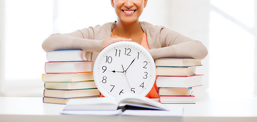 Image showing attractive woman with white clock