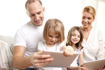 Image showing happy family with tablet pc computers at home