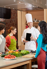 Image showing happy women with chef and tablet pc in kitchen