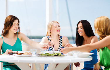 Image showing girls in cafe on the beach