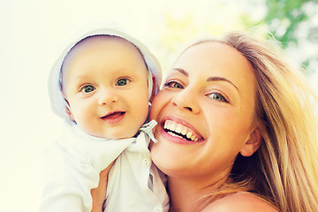 Image showing happy mother with little baby outdoors