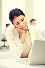 Image showing businesswoman with laptop computer at work